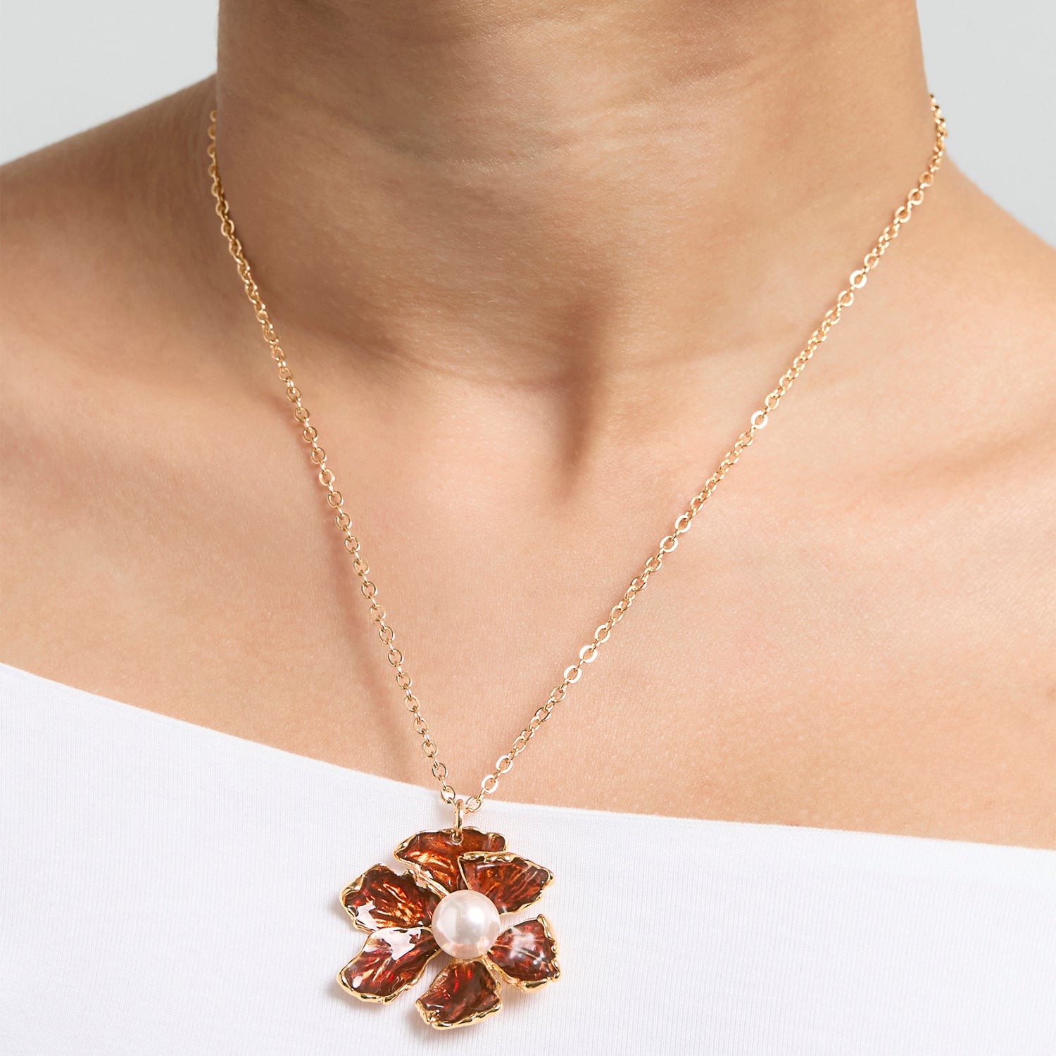 BCBG Gold-Tone Floral Pendant Necklace with Pearl Detail