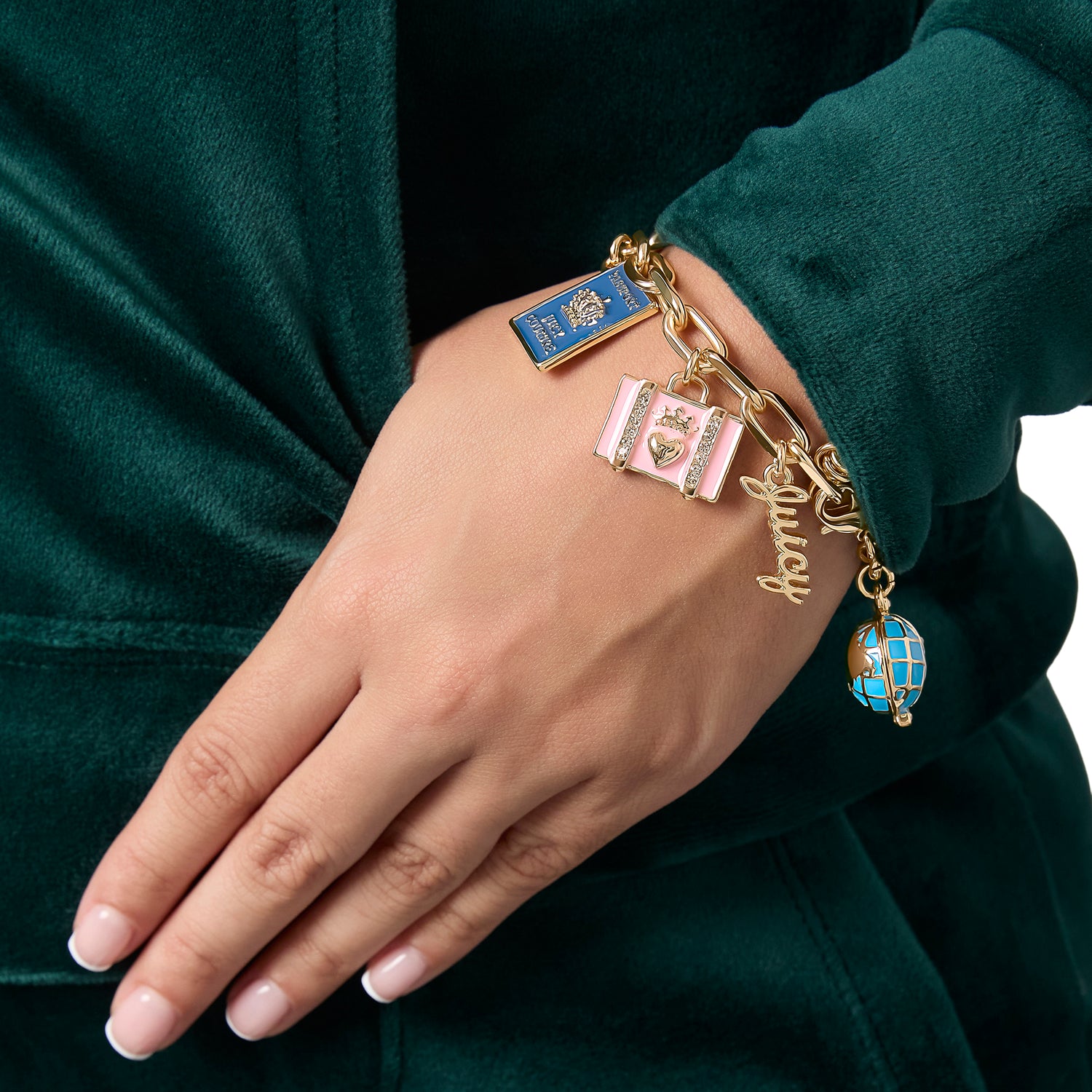 Juicy Couture Travel Icons Charm Bracelet, Gold‑Tone with Blue & Pink Enamel