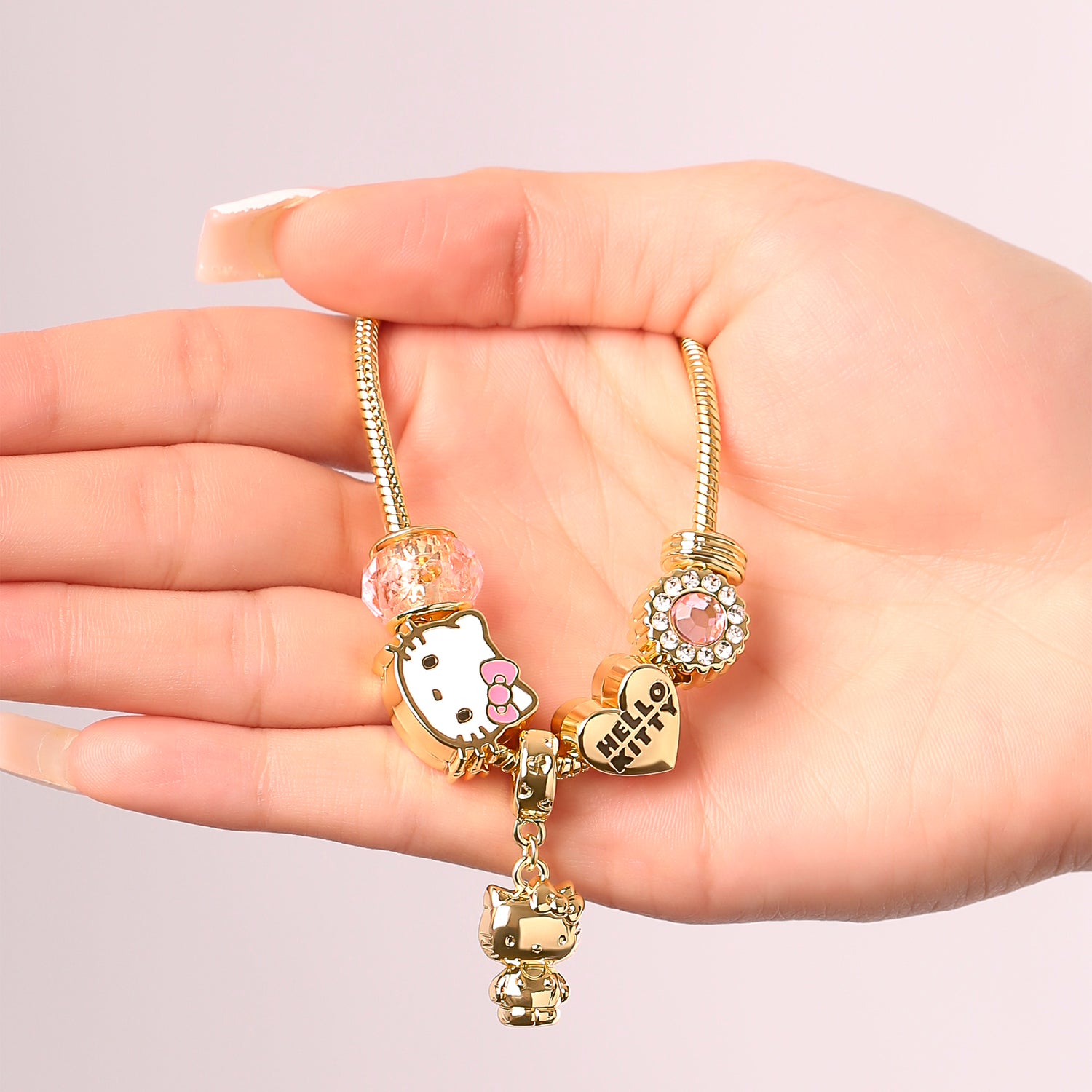 SALLY ROSE Hello Kitty Charm Bracelet for Women, 7" Gold-Tone Sanrio Bracelets with 6 Unique Charms Official License