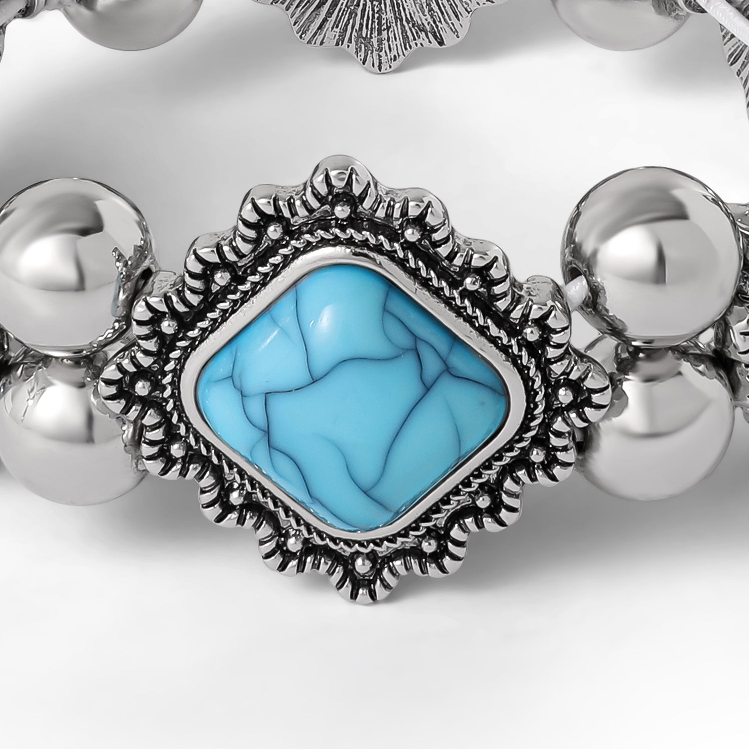 Jessica Simpson Turquoise and Silver Stretch Bracelet with Western Motif