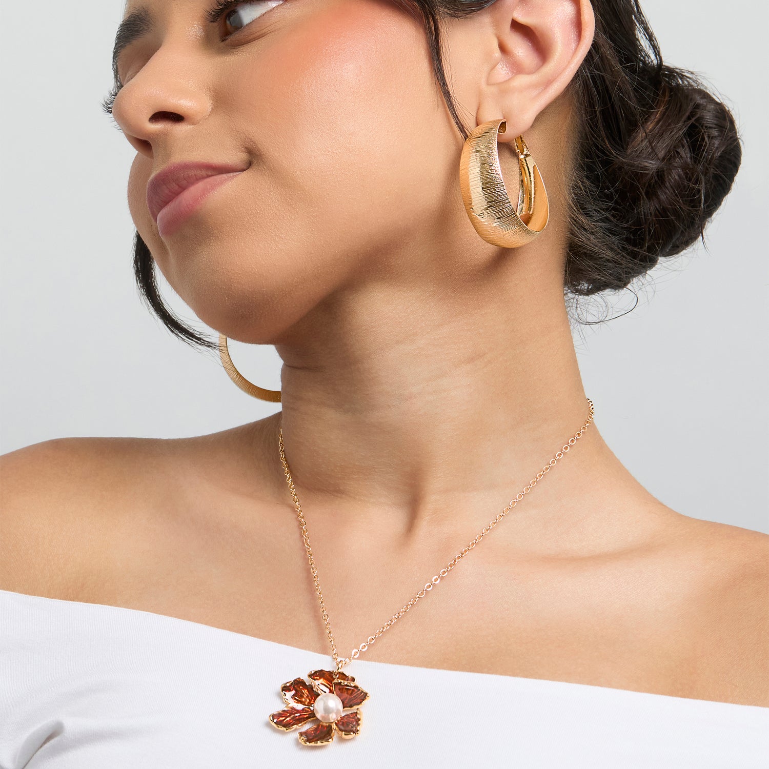 BCBG Gold-Tone Floral Pendant Necklace with Pearl Detail