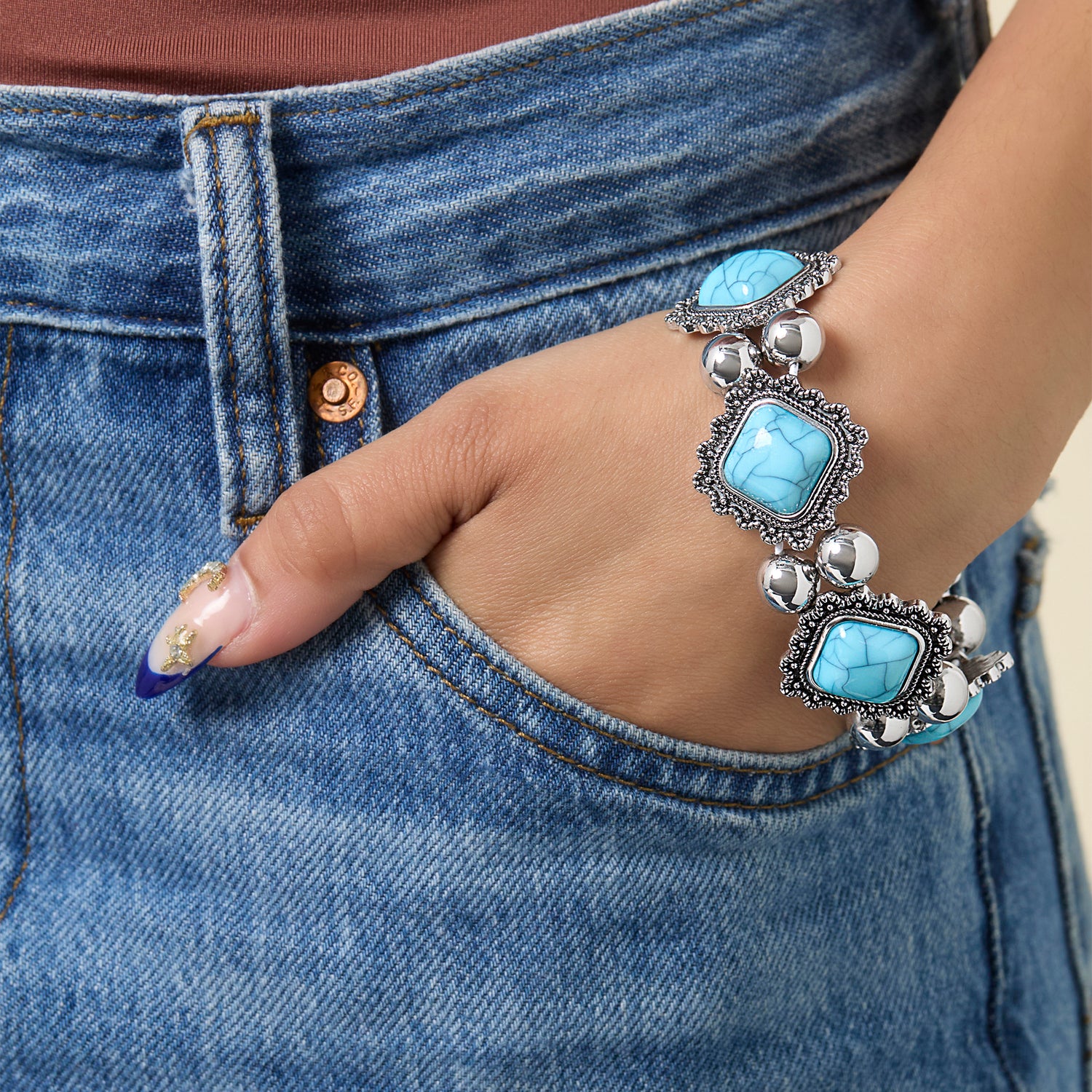 Jessica Simpson Turquoise and Silver Stretch Bracelet with Western Motif