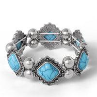 Jessica Simpson Turquoise and Silver Stretch Bracelet with Western Motif