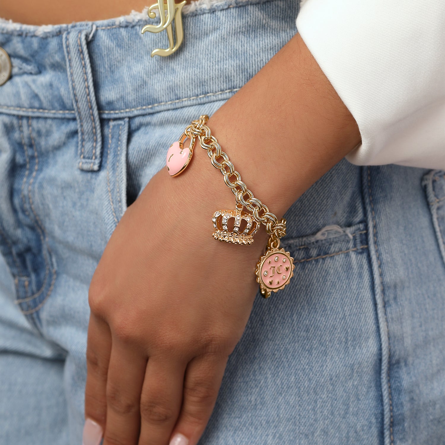 Juicy Couture Charms Bracelet with Clear Stones, 7.5" Goldtone Bracelet for Women Featuring 6 Pink and Gold Charms