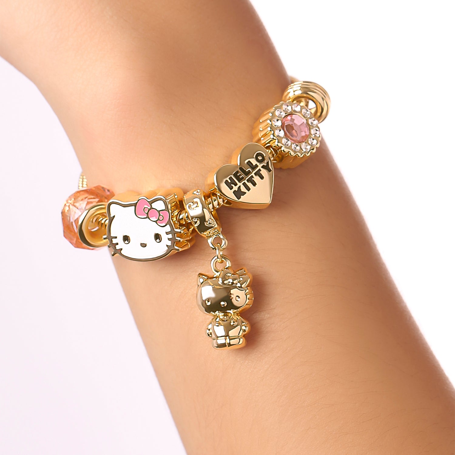 SALLY ROSE Hello Kitty Charm Bracelet for Women, 7" Gold-Tone Sanrio Bracelets with 6 Unique Charms Official License