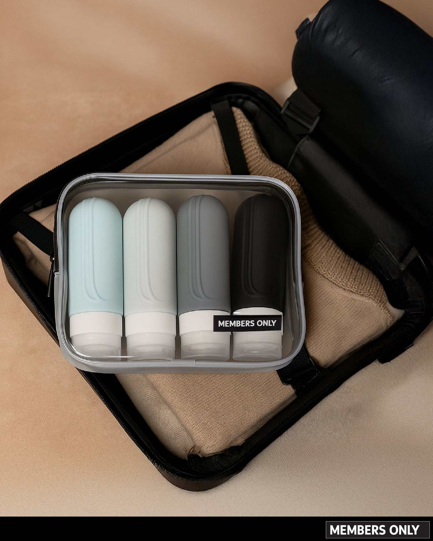 MEMBERS ONLY 4 PIECE SILICONE TRAVEL BOTTLE SET WI